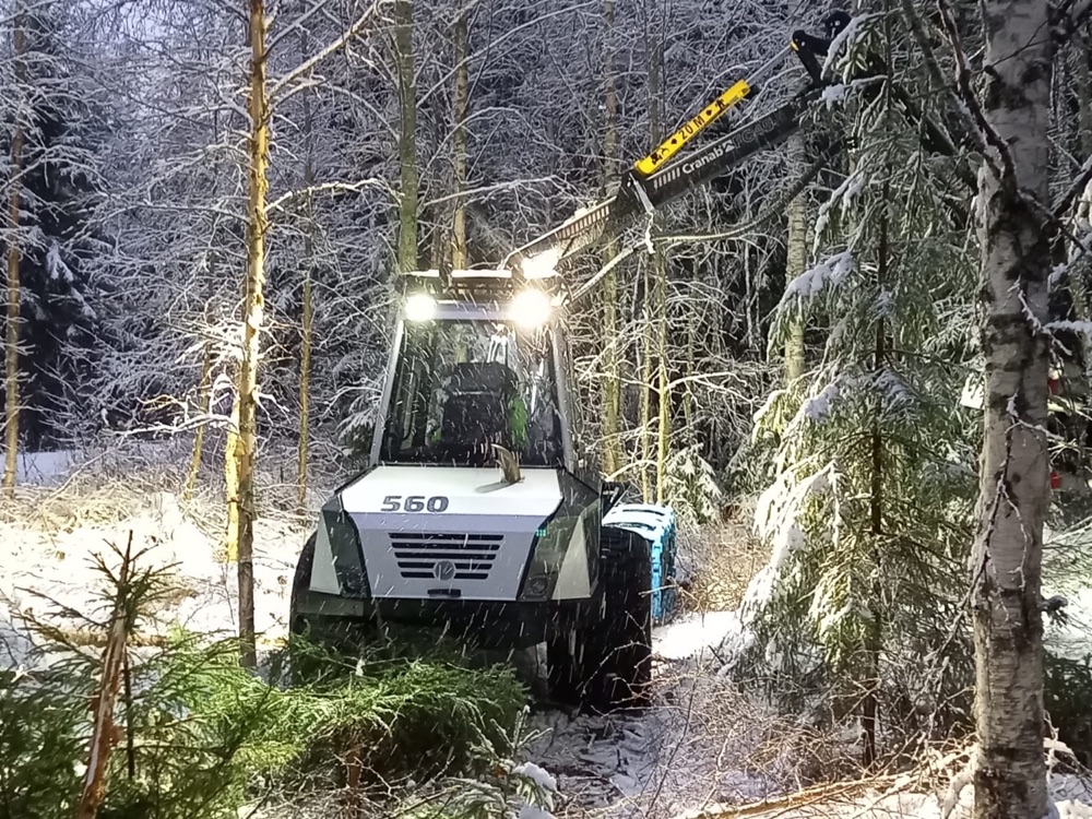 ZertiCarbon-branded forestry machine working on a replanting site at dusk